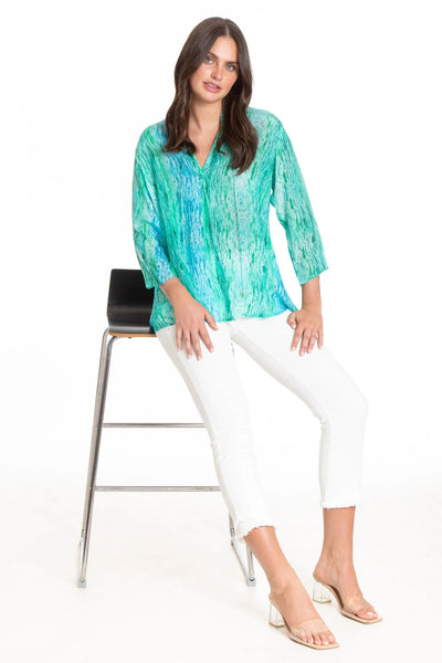Raindrops and Ripples Print Tunic Seated in Chair.