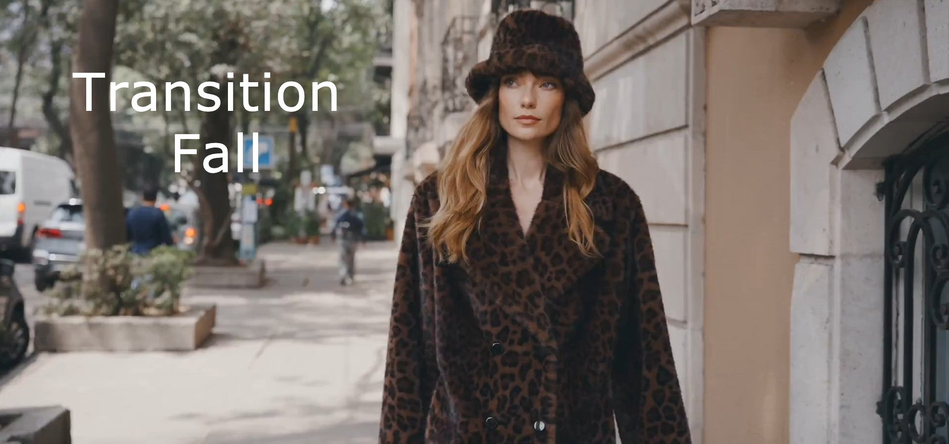 Woman in a leopard print coat and fur hat on a city street with 'Transition Fall' text.