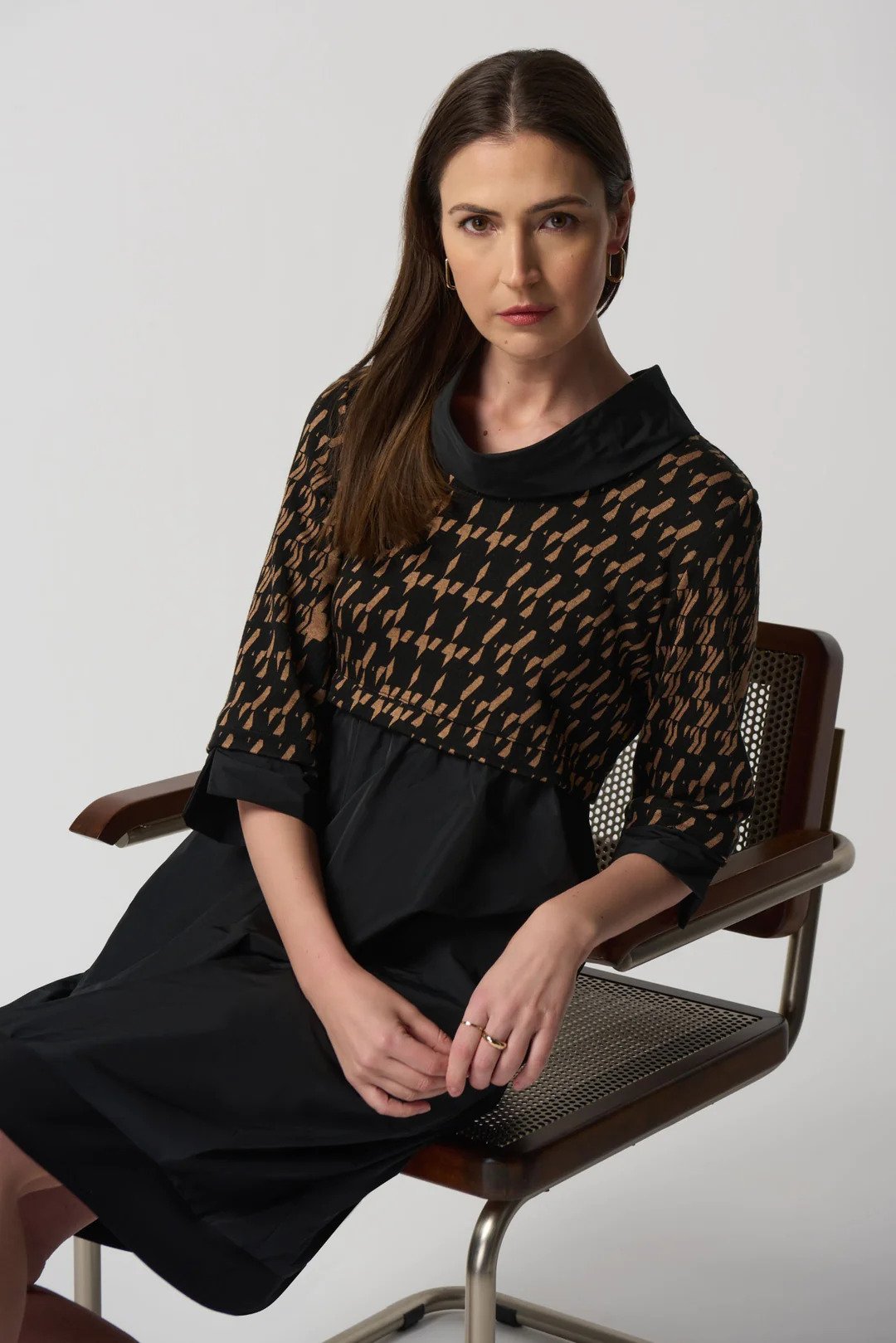 Houndstooth Print Dress Style 233174 Posing in a Chair.