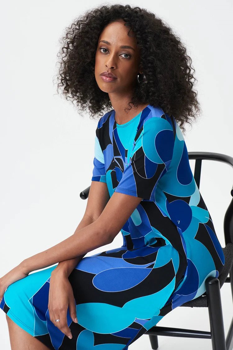 Abstract Print Dress Style 232267 Seated in Chair.