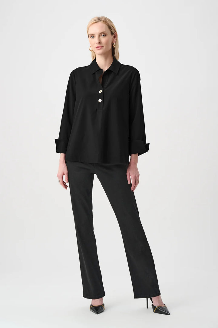 Full length view of the Joseph Ribkoff black poplin shirt-collar boxy top styled with black pants and heels.