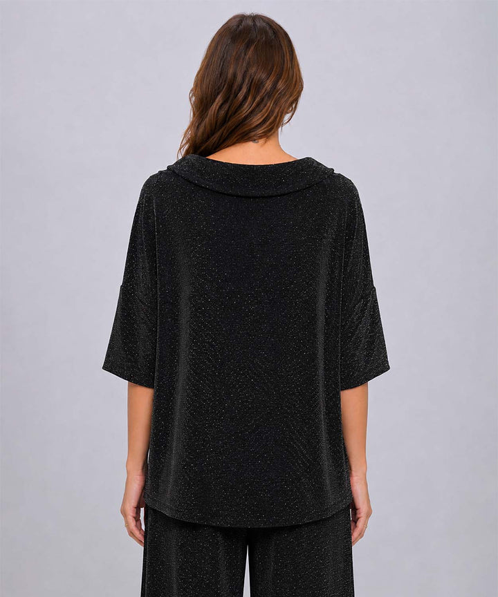 A view from behind of the black Last Tango Glitter High-Low Top in front of a grey studio background