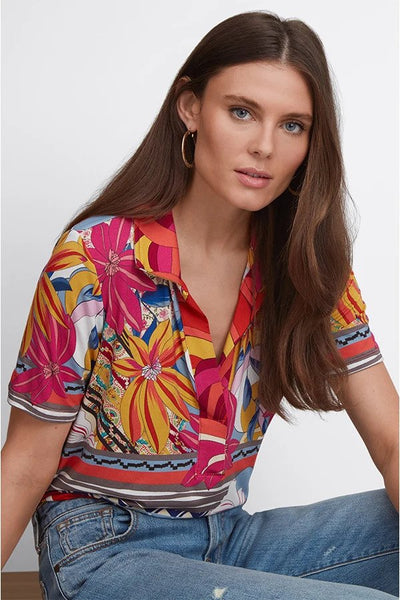Rachel May Short Sleeve Swing Polo Seated Pose.
